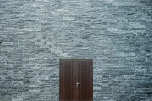 brown-wooden-door-brick-wall