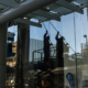 two people cleaning the exterior glass