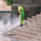 a person pressure washing stairs