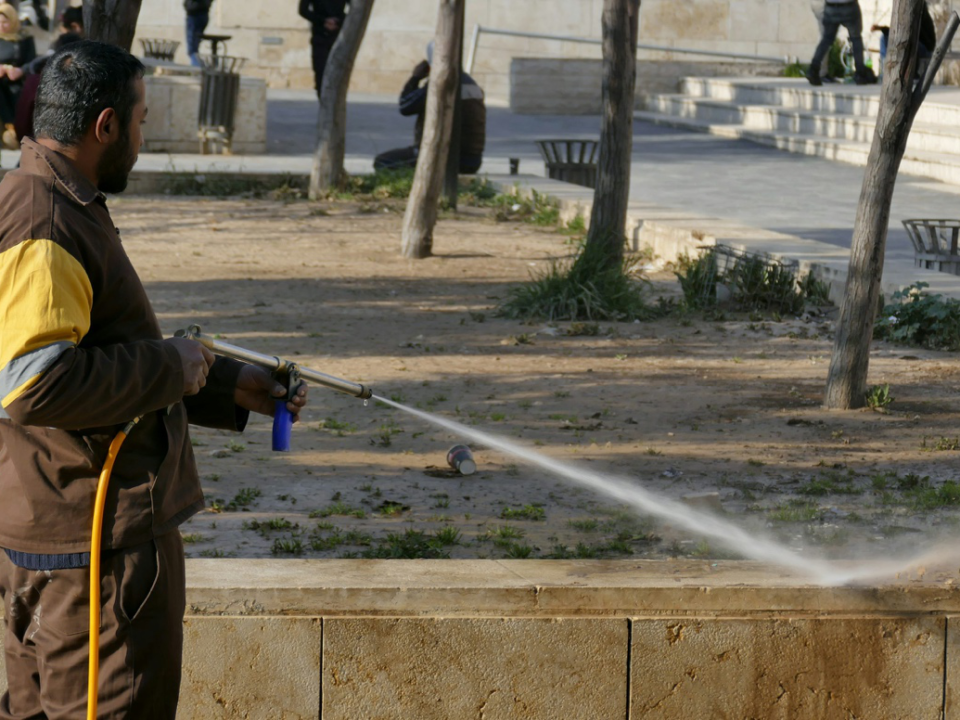 a person pressure washing